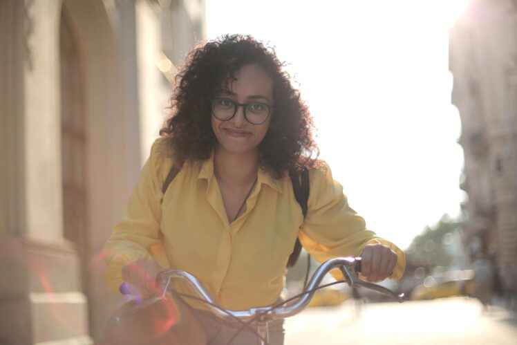 Female Student Riding a Bicycle as A Transport Method