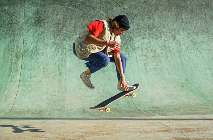 Student driving a skateboard as a method of transportation