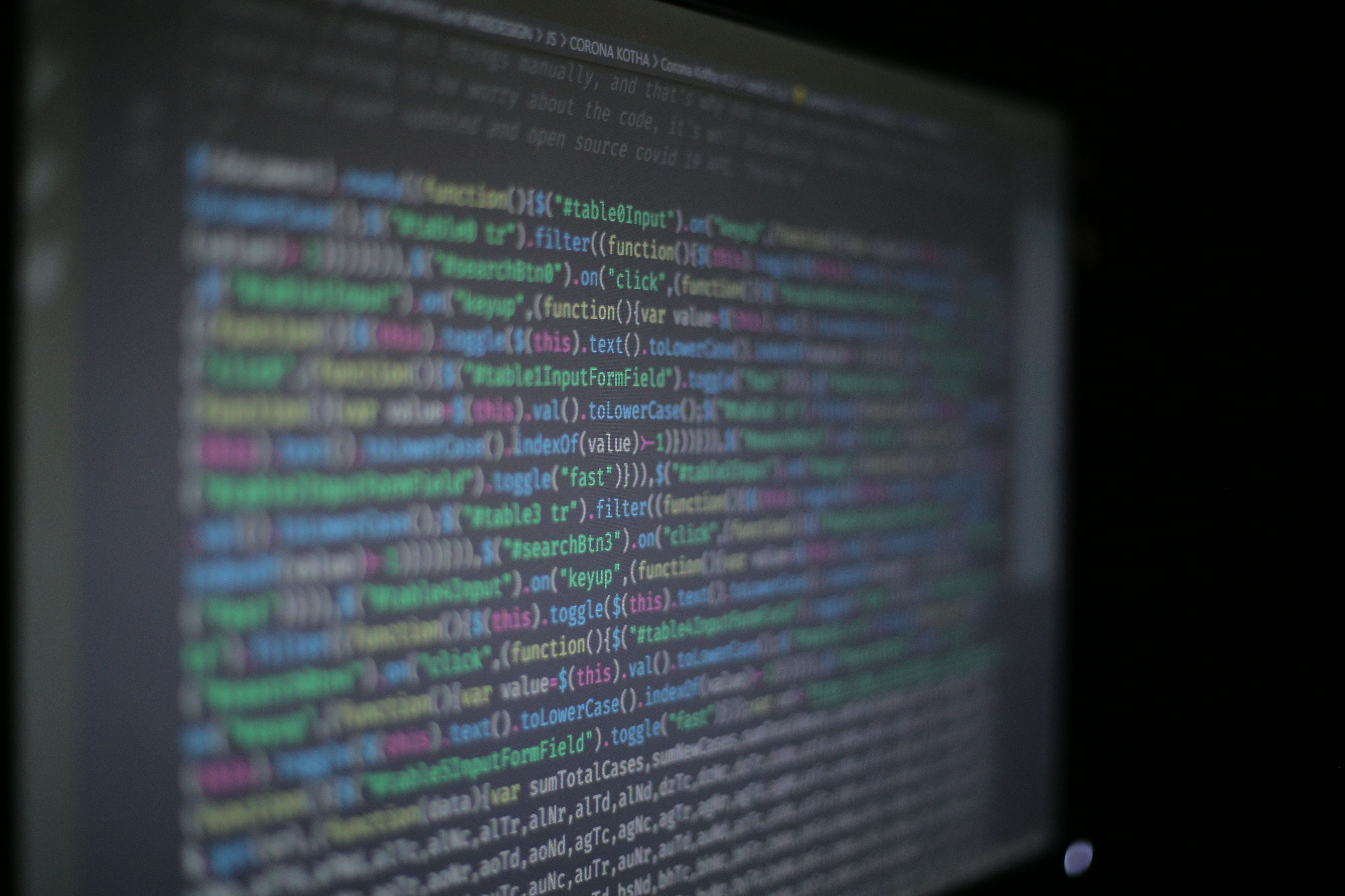 Close-up of colorful programming code representing software vulnerability research
